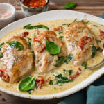 Chicken fillet with spinach and sun-dried tomatoes in coconut milk.