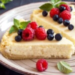 a low calorie dessert of homemade cheesecake with fresh berries and mint