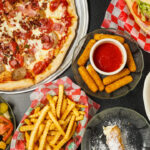 Top view of Pizza doner, variety of side dishes