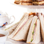 tea set served with tea sandwiches