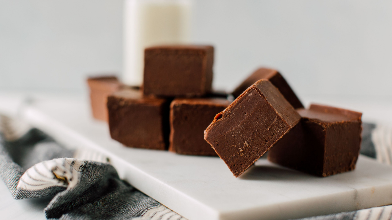 3-ingredient-dessert fudge served on a table with milk in the background