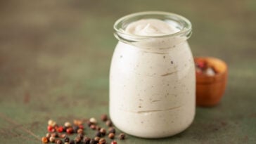 Alabama white BBQ sauce in bowl and ingredient for dip .