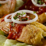 Chiles rellenos with salsa from Guatemala.