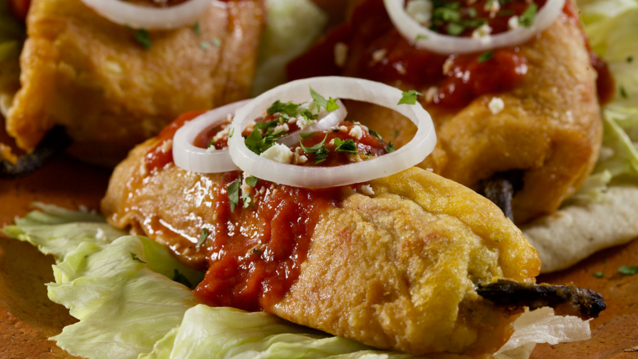 Chiles rellenos with salsa from Guatemala.