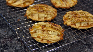 apple pie cookies cooling on metal rack