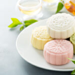 Snow skin sweet and savory traditional Chinese mooncakes with variety of fillings and green tea