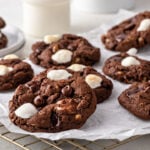 Chocolate chip and marshmallow dark chocolate cookies served with milk.