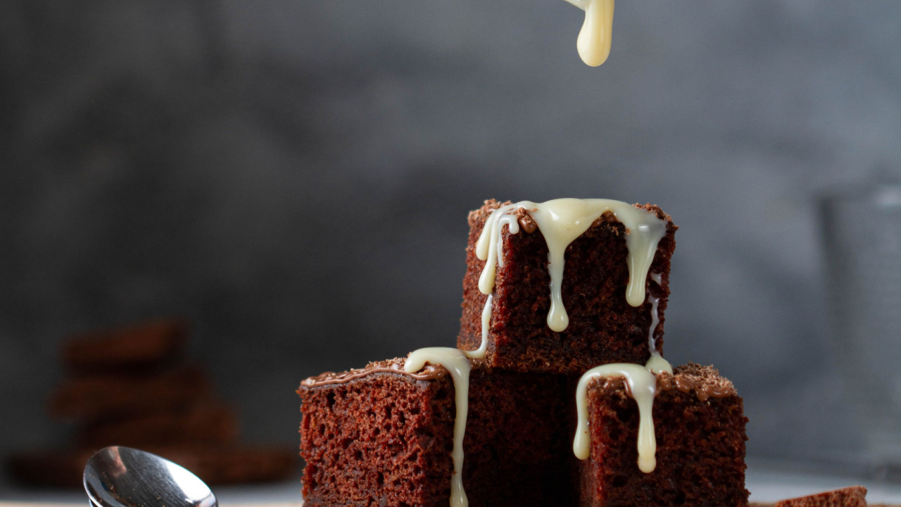 Diced brownie with sweet condensed milk sauce drips