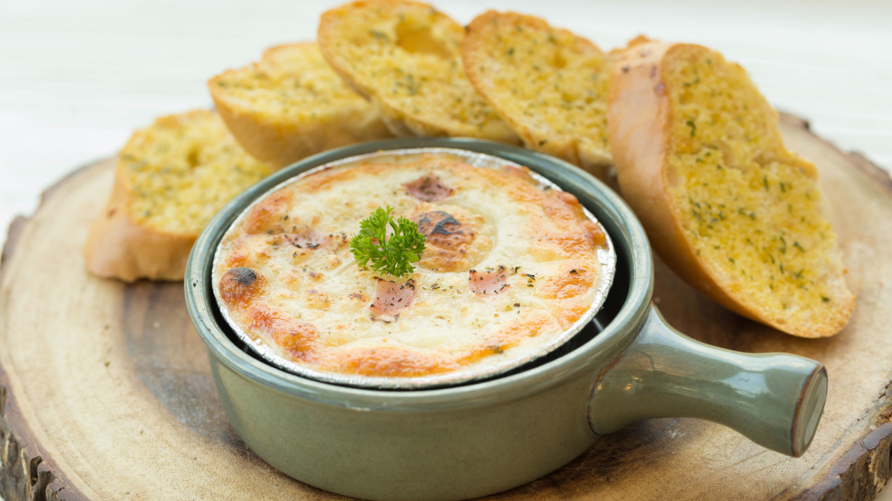 baked pizza dip with Garlic bread.