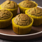Homemade keto diet muffins with spinach on ceramic plate ready to eat. Healthy vegan breakfast. Ketogenic diet, sugar free, dairy free and gluten free food.
