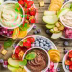 Homemade Sweet Hummus with strawberries, apple, crackers, grapes. Variations of different hummus dessert dips