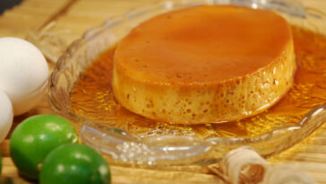 Filipino style crème caramel (leche flan) in caramel sauce shown with ingredients.