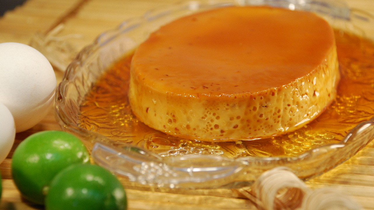 Filipino style crème caramel (leche flan) in caramel sauce shown with ingredients.