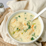 Traditional Italian chicken gnocchi soup with spinach, cream and carrots.