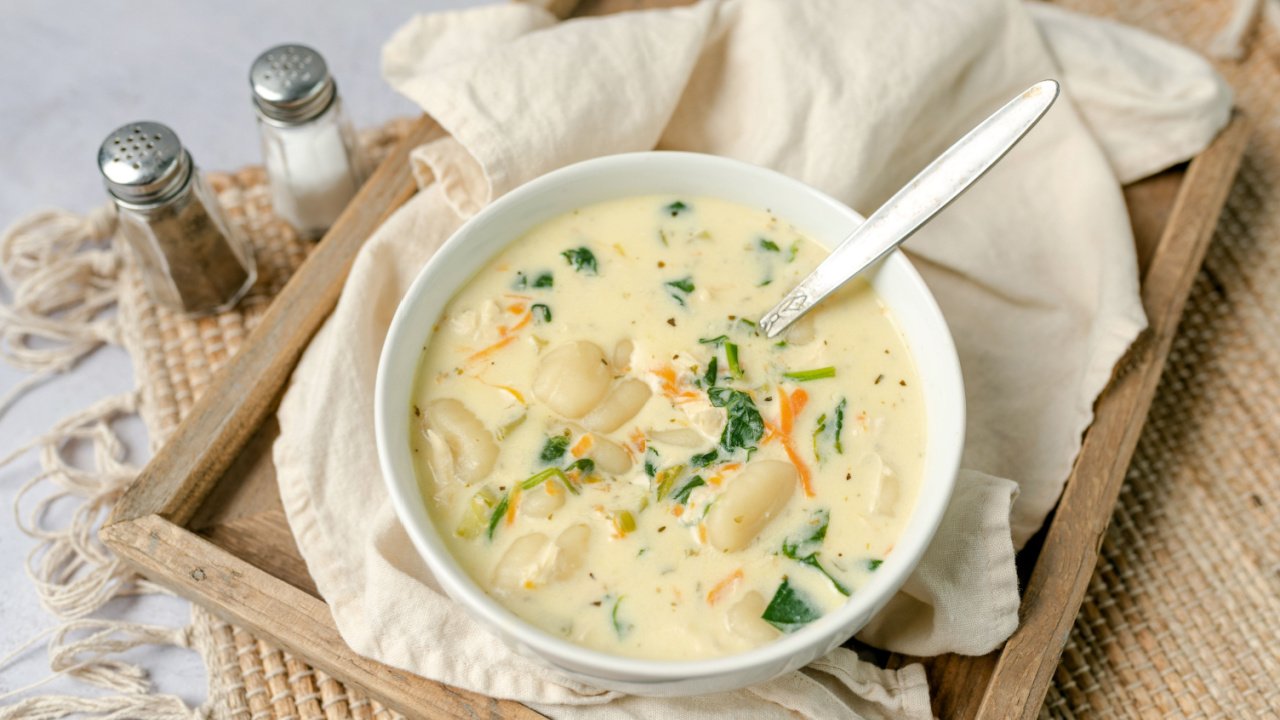 Traditional Italian chicken gnocchi soup with spinach, cream and carrots.