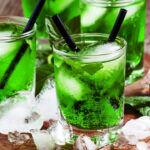 Green cocktail with mint, ice and soda