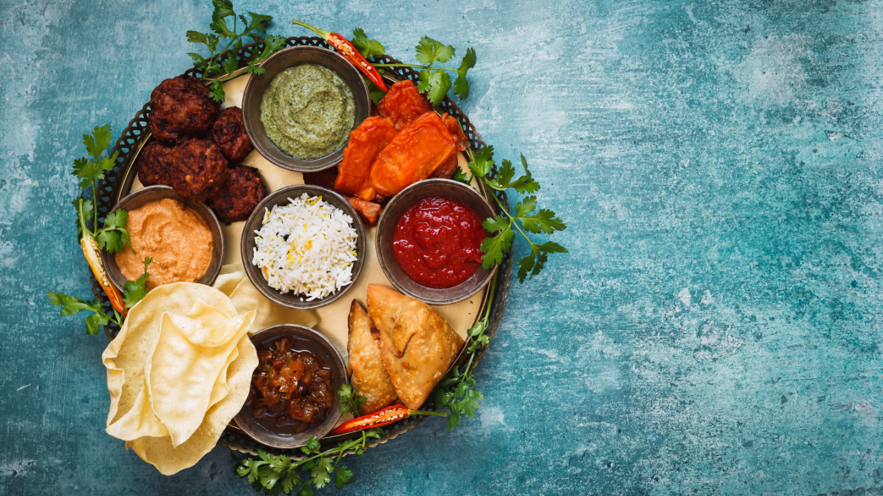 Vegetarian Thali. Indian appetizers and snacks: pakora, samosas and bhaji served with chutneys and other dipping sauces.