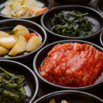 various korean side dishes served on small plates