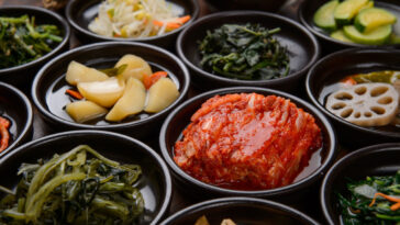 various korean side dishes served on small plates