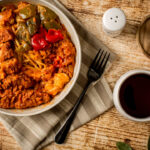 Hong Kong style Baked Pork Chop with Spaghetti with Blackcurrant juice on the table.