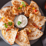 mexican quesadilla with chicken tomato corn cheese - a mexican appetizers