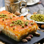 Basbousa with cream and pistachio is one of the traditional dishes in the Middle East