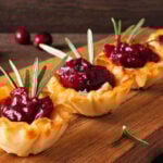 Holiday phyllo pastry appetizers with cranberries and baked brie.