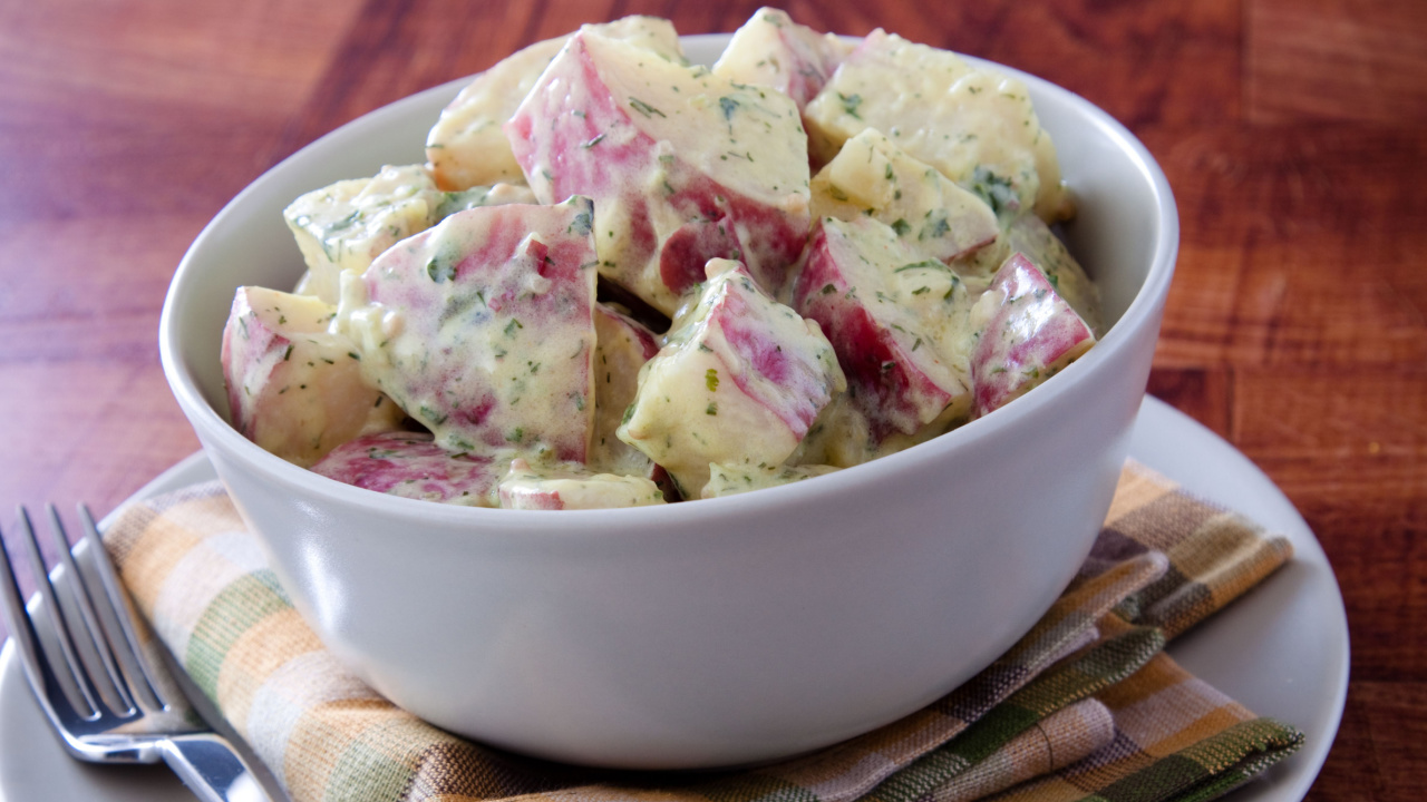 Delicious creamy potato salad dressed in mayo infused with dijon mustard.