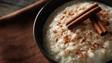 Delicious rice pudding with cinnamon in bowl