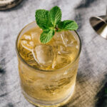 Alcoholic Whiskey Smash Cocktail bourbon whiskey with fresh lemon juice, syrup and mint leaves