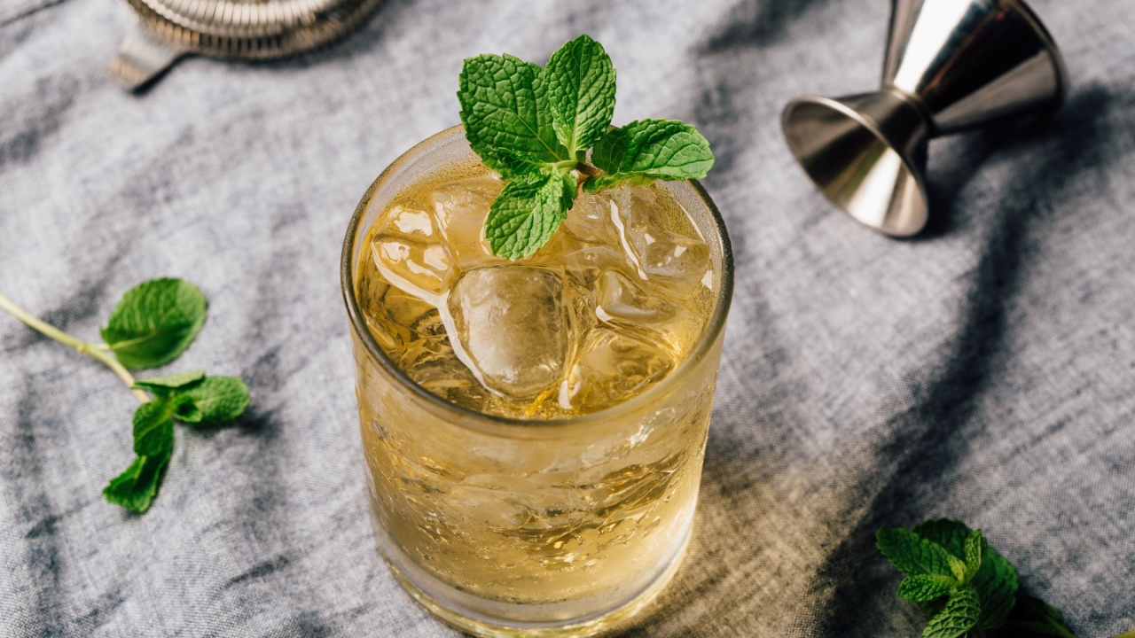 Alcoholic Whiskey Smash Cocktail bourbon whiskey with fresh lemon juice, syrup and mint leaves