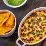 Dish of Jalapeno popper dip with cheese and bacon