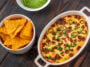 Dish of Jalapeno popper dip with cheese and bacon
