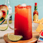 Michelada - Mexican inspired cocktail with beer, lime juice, tomato juice, spicy sauce and spices.
