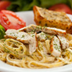 Chicken Alfredo pasta on the table.