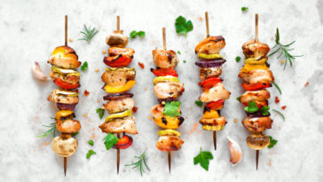 Grilled vegetable and chicken skewers with bell peppers, zucchini, onion and mushrooms.