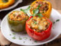 Stuffed peppers in a baking dish on a blue wooden table